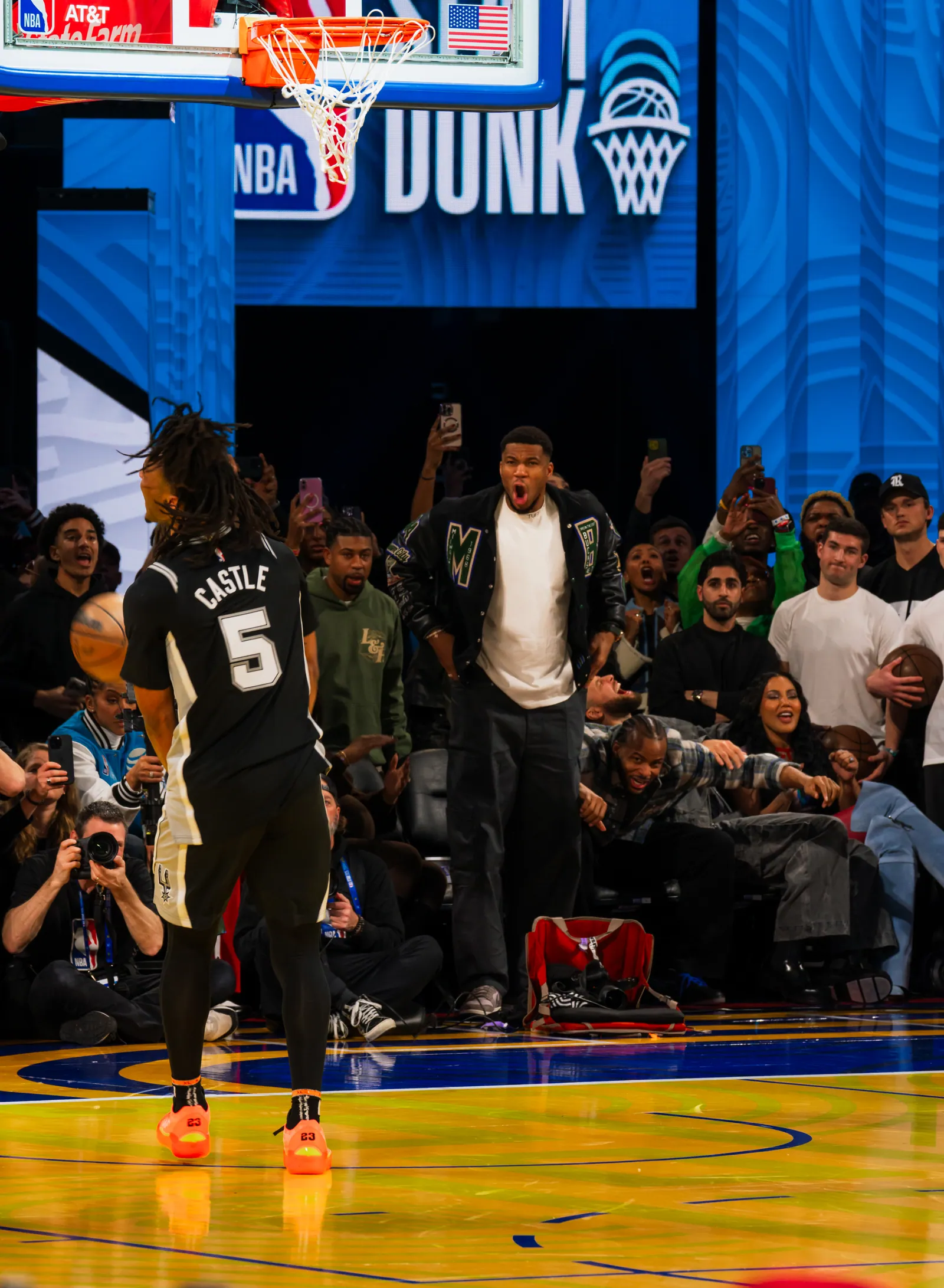 Stephon Castle throws down a dunk as Giannis Antetokounmpo screams in excitement at the 2025 NBA All-Star Slam Dunk Contest